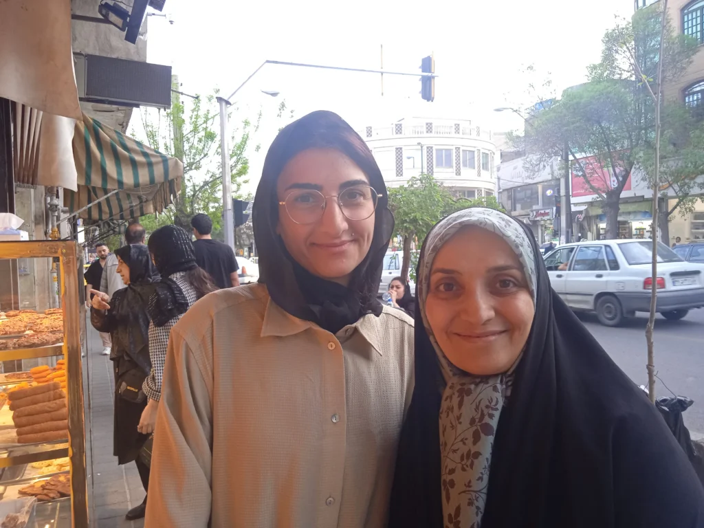 A foreign and Iranian woman in the street