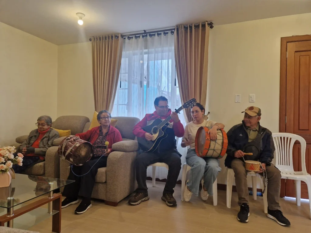 Four people playing musical instruments.