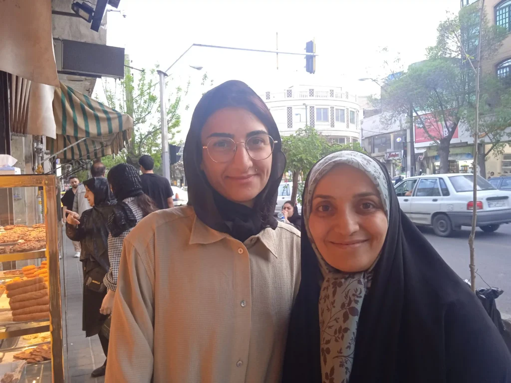 Two women with covered heads in a sexually deprived men's country - Iran