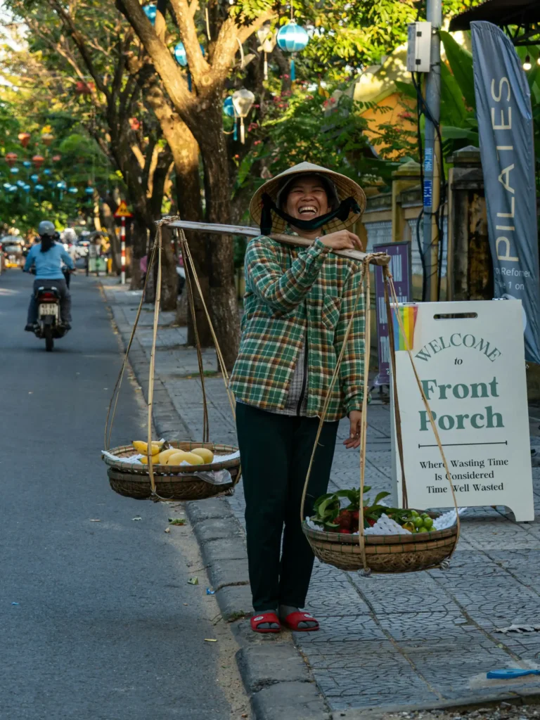 Vietnamese woman carrying baskets